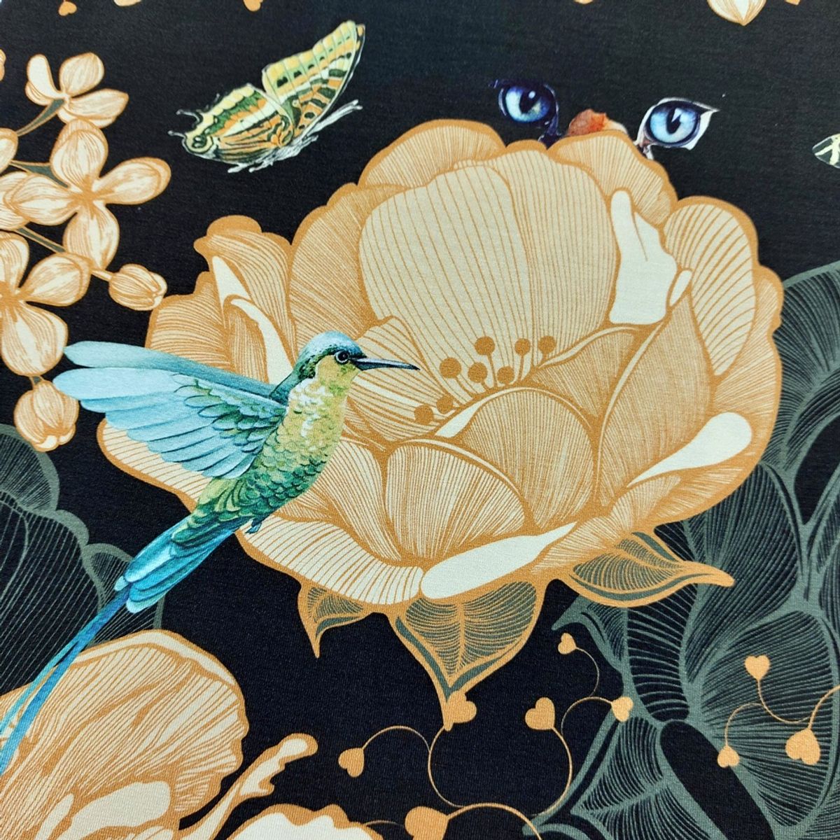 Viskosejersey - oransje blomster m. sommerfugler